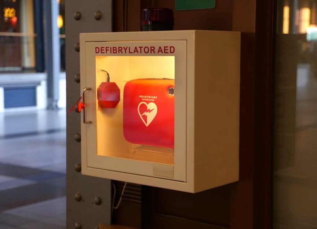 Wall-mounted AED cabinet serviced by LifeSafe